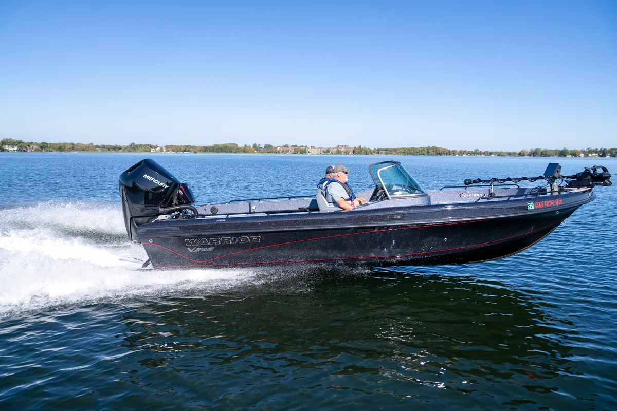 Warrior V238 running to the right across open water on a clear day